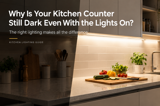 Kitchen counter with vegetables on a cutting board, showing shadowed and illuminated areas under cabinet lighting.