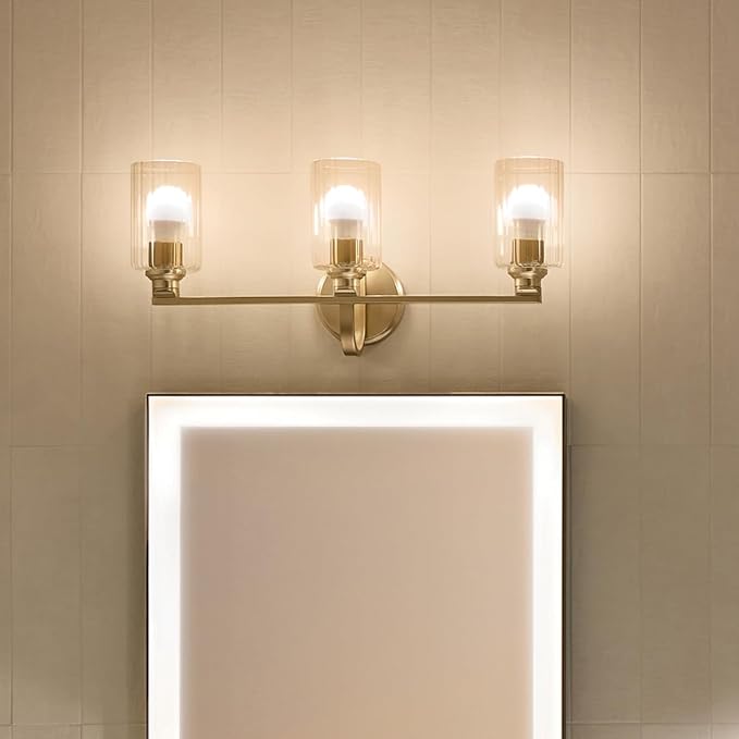 Kichler Gioe 24.25" 3-Light Bathroom Vanity Light Fixture with Clear Fluted Glass in Champagne Bronze, Damp Rated for Mirror, Powder Room (24.25" W x 10.5" H), 55226CPZFLU