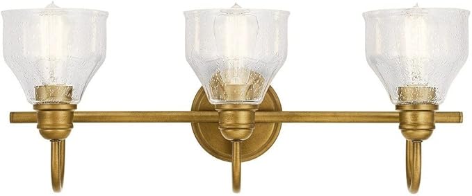 Kichler Avery 3-Light Bathroom Vanity Light Fixture with Clear Seeded Glass, Industrial Farmhouse Style in Natural Brass for Damp Locations (24" x 9.25"), 45973NBR