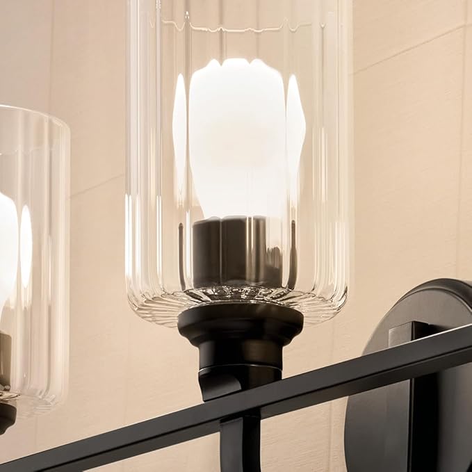 Kichler Gioe 24.25" 3-Light Bathroom Vanity Light Fixture with Clear Fluted Glass in Black, Modern Wall Mount Over Mirror for Powder Room, Damp Rated (24.25" W x 10.5" H), 55226BKFLU