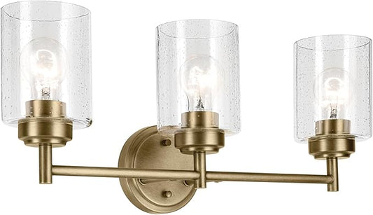Kichler Winslow 21.5" 3-Light Bathroom Vanity Light Fixture with Clear Seeded Glass in Natural Brass for Luxe Industrial Style Over Mirror (21.5" x 9.25"), 45886NBR