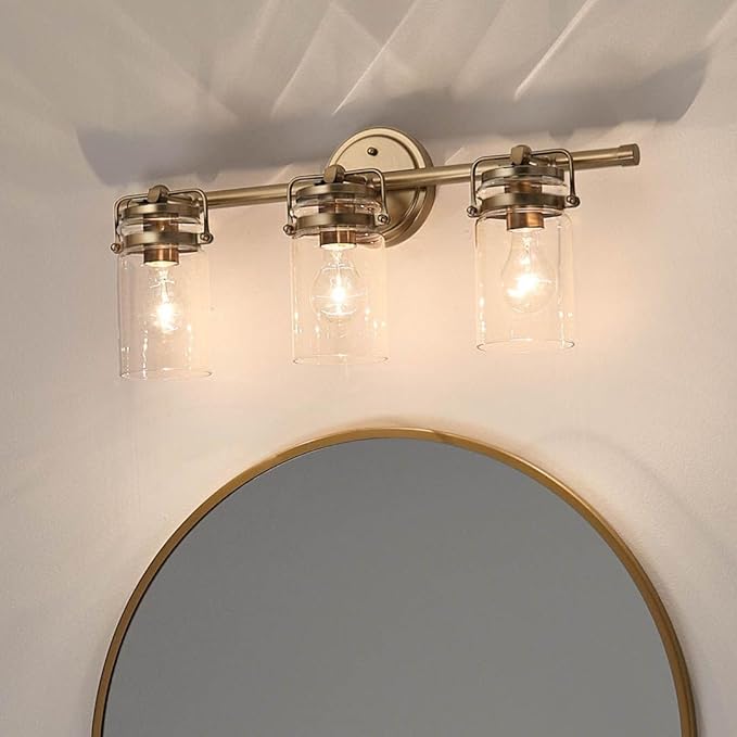 Kichler Brinley 24" 3-Light Bathroom Vanity Light Fixture with Clear Glass in Champagne Bronze, Modern Farmhouse Mason Jar Style for Mirror Lighting (24" W x 10.25" H), 45689CPZ