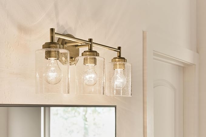 Kichler Winslow 21.5" 3-Light Bathroom Vanity Light Fixture with Clear Seeded Glass in Natural Brass for Luxe Industrial Style Over Mirror (21.5" x 9.25"), 45886NBR