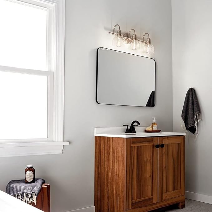 Kichler Avery 3-Light Bathroom Vanity Light Fixture with Clear Seeded Glass, Industrial Farmhouse Style in Natural Brass for Damp Locations (24" x 9.25"), 45973NBR