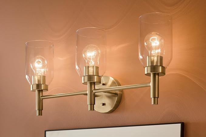 Kichler Madden 3-Light Bathroom Vanity Light Fixture with Clear Glass in Champagne Bronze, Modern Wall Mount Lighting for Single Vanity Mirror (10.5" x 24"), 55185CPZ